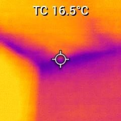 Cold spot in the corner attracting Condensation. Dirt and discoloured wall with visible patches near the ground.
